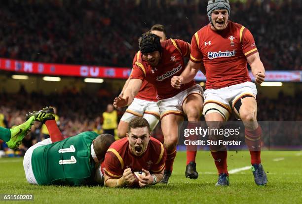 George North of Wales celebrates after scoring the opening try during the Six Nations match between Wales and Ireland at the Principality Stadium on...