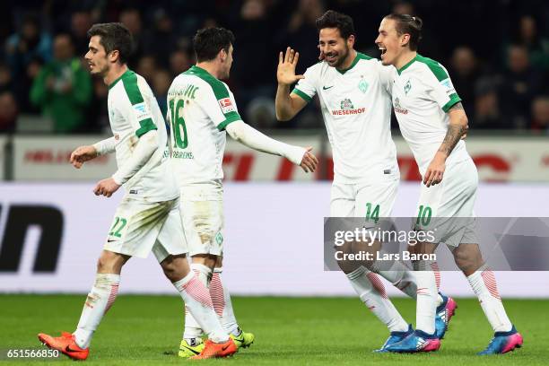 Claudio Pizarro of Bremen celebrates his team's first goal with team mates Fin Bartels, Zlatko Junuzovic and Max Kruse during the Bundesliga match...