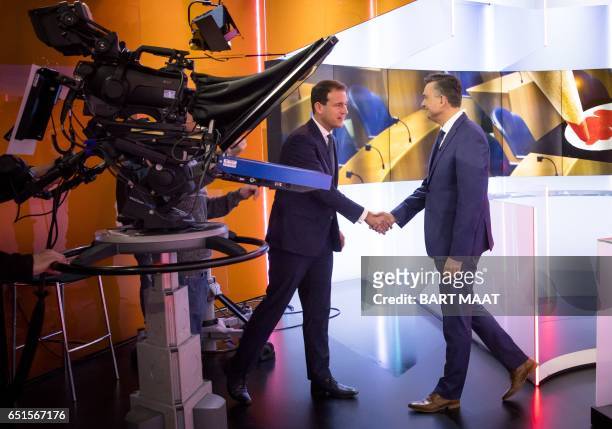 Emile Roemer of the Socialist Party and Lodewijk Asscher of the Party of Labor shake hands prior to a debate of the TV program EenVandaag ahead the...