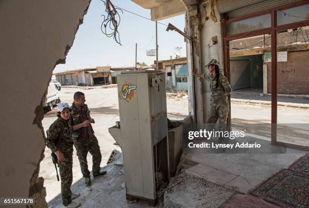 Deniz Derek right, and Sarya Dijwar stand in the former ISIS and Jabat al Nusra stronghold of Tel Bark, which was taken over by YPG fighters less...