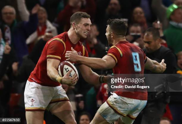 George North of Wales celebrates as he scores their second try with team mate Rhys Webb during the Six Nations match between Wales and Ireland at the...