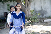Schoolgirls on bicycle