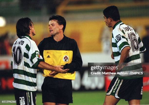 Sporting Lisbon's Ricardo Sa Pinto and Mario Jardel appeal to Referee Bruno Paixao