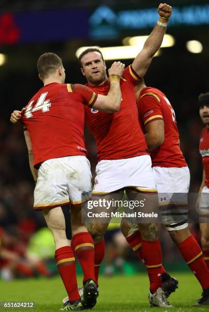 Jamie Roberts of Wales celebrates as he scores their third try with George North during the Six Nations match between Wales and Ireland at the...