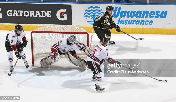 Janne Kuokkanen of the London Knights looks to make a pass against the Guelph Storm during an OHL game at Budweiser Gardens on March 9, 2017 in...