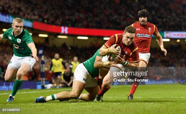 George North of Wales scores the first try during the Six Nations match between Wales and Ireland at the Principality Stadium on March 10, 2017 in...