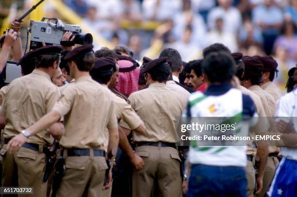 Spanish police surround the President of the Kuwaiti FA, Prince Fahid , as he discusses with his players the controversial circumstances surrounding...