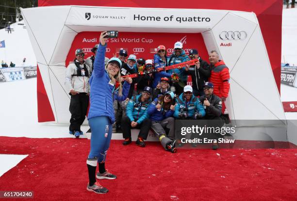 Mikaela Shiffrin of the United States takes a selfie with the US Ski Team behind her after she won the Audi FIS World Cup Ladies' Giant Slalom on...