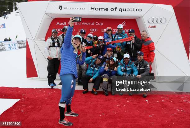 Mikaela Shiffrin of the United States takes a selfie with the US Ski Team behind her after she won the Audi FIS World Cup Ladies' Giant Slalom on...