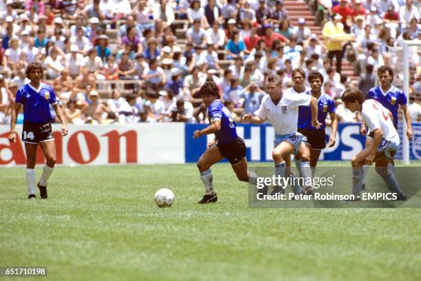 England's Peter Reid gives chase as Argentina's Diego Maradona goes forward on another run