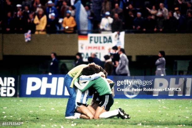 Argentina goalkeeper Ubaldo Fillol celebrates victory with teammate Alberto Tarantini and two adoring fans