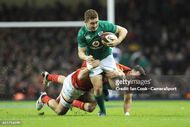 Ireland's Paddy Jackson is tackled by Wales' Sam Warburton and Gareth Davies during the RBS Six Nations Championship match between Wales and Ireland...