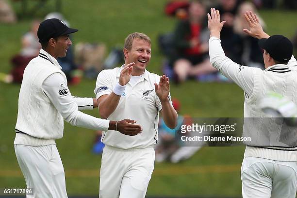 Neil Wagner of New Zealand celebrates the dismissal of Hashim Amla during day four of the First Test match between New Zealand and South Africa at...