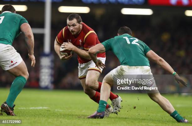 Ken Owens of Wales is challenged by Robbie Henshaw of Ireland during the Six Nations match between Wales and Ireland at the Principality Stadium on...