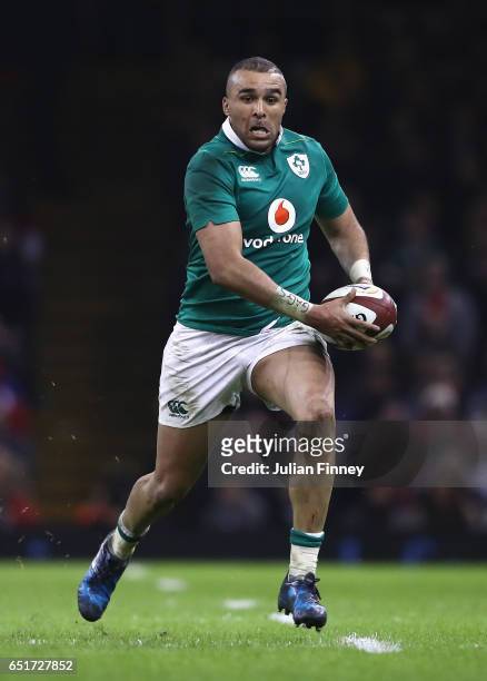 Simon Zebo of Ireland runs with the ball during the Six Nations match between Wales and Ireland at the Principality Stadium on March 10, 2017 in...