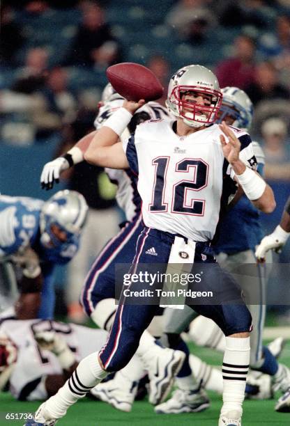 Quarterback Tom Brady of the New England Patriots looks to pass the ball during the game against the Detroit Lions at the Pontiac Silverdome in...