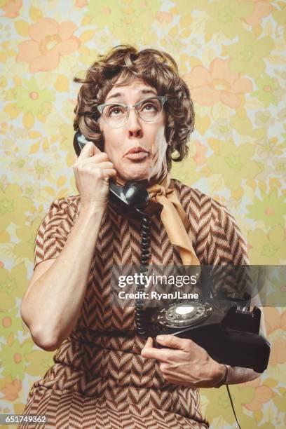 adult woman retro seventies style - funny looking at phone stock pictures, royalty-free photos & images