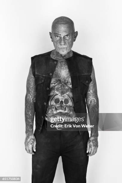 portrait of shaven headed older man with tattoos - fully unbuttoned stockfoto's en -beelden