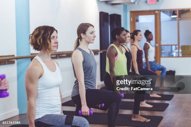 multi-ethnic group of women doing barre workout - hesitant to dance stock pictures, royalty-free photos & images