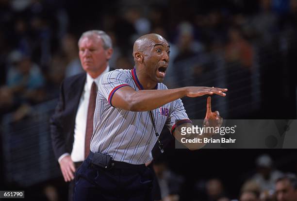 Referee calls a time-out during the game between the Denver Nuggets and the Houston Rockets at the Pepsi Center in Denver, Colorado. The Nuggets...