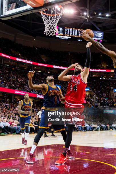 James Jones of the Cleveland Cavaliers puts pressure on Nikola Mirotic of the Chicago Bulls during the second half at Quicken Loans Arena on February...