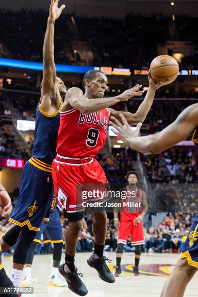 Rajon Rondo of the Chicago Bulls passes while under pressure from James Jones of the Cleveland Cavaliers during the second half at Quicken Loans...