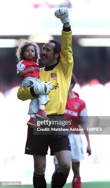 Arsenal's David Seaman celebrates after the final whistle with his daughter Georgina