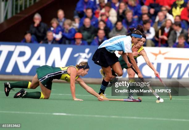 Austrtalia's Renita Garard leans in to tackle Argentina's Luciana Aymar