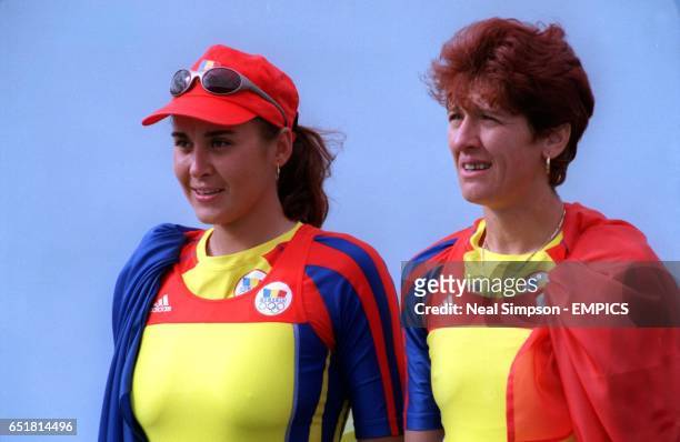 Romania's Coxless Pairs team of Georgeta Damian and Doina Ignat celebrate winning the gold medal
