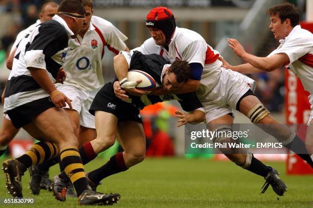 Barbarians' Mark Robinson is tackled by England's Alex Codling