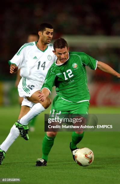 Ireland's Mark Kinsella evades the challenge of Saudi Arabia's Abdulaziz Khathran