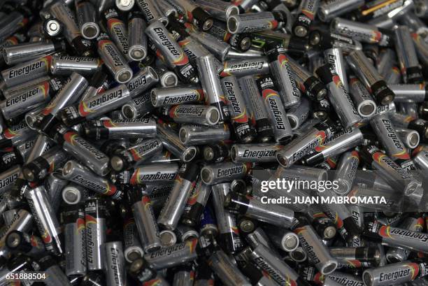 Used alkaline batteries for disposal are seen in a television studio in Buenos Aires, Argentina, on March 10, 2017. / AFP PHOTO / JUAN MABROMATA