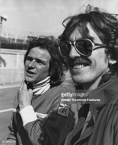 British racing motorcyclist Barry Sheene with his friend, former Beatle George Harrison , at the Brands Hatch racing circuit in Kent, 25th April...