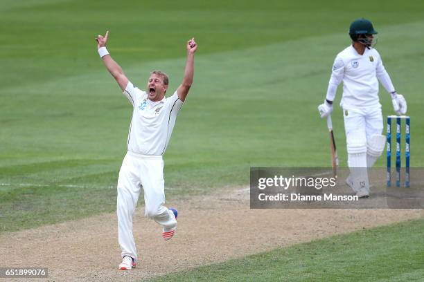 Neil Wagner of New Zealand celebrates the dismissal of JP Duminy of South Africa during day four of the First Test match between New Zealand and...