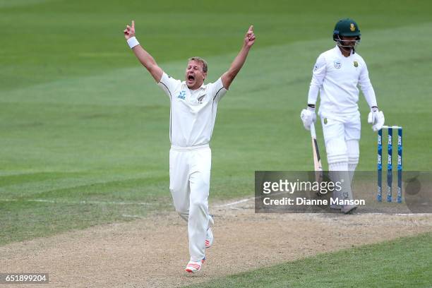 Neil Wagner of New Zealand celebrates the dismissal of JP Duminy of South Africa during day four of the First Test match between New Zealand and...