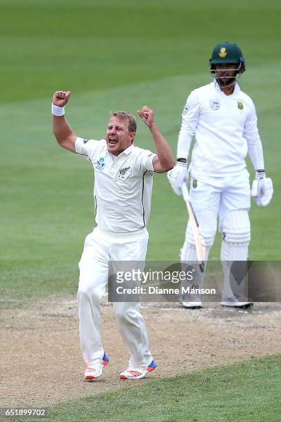 Neil Wagner of New Zealand celebrates the dismissal of JP Duminy of South Africa during day four of the First Test match between New Zealand and...