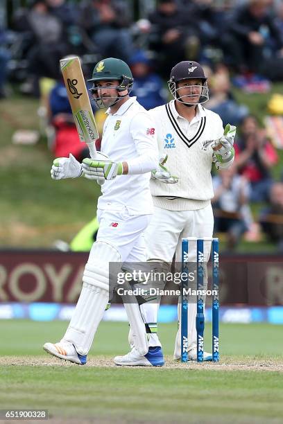 Dean Elgar of South Africa celebrates his half century during day four of the First Test match between New Zealand and South Africa at University...