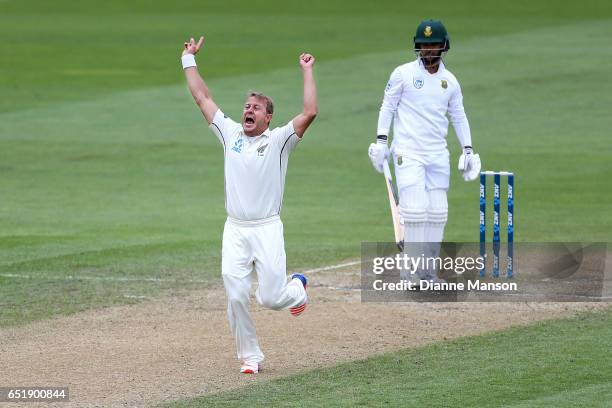 Neil Wagner of New Zealand celebrates the dismissal of JP Duminy of South Africa during day four of the First Test match between New Zealand and...