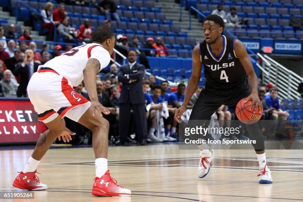 Tulsa Golden Hurricane guard Sterling Taplin defended by Cincinnati Bearcats guard Kevin Johnson during the first half of the American Athletic...
