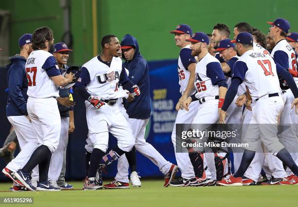 Adam Jones of the United States celebrates a walk off RBI single in the 10th inning during a Pool C game of the 2017 World Baseball Classic against...