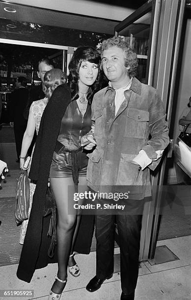 English film director Michael Winner and Australian actress Valli Kemp attend the London premiere of the film 'Sunday Bloody Sunday', 1st July 1971.