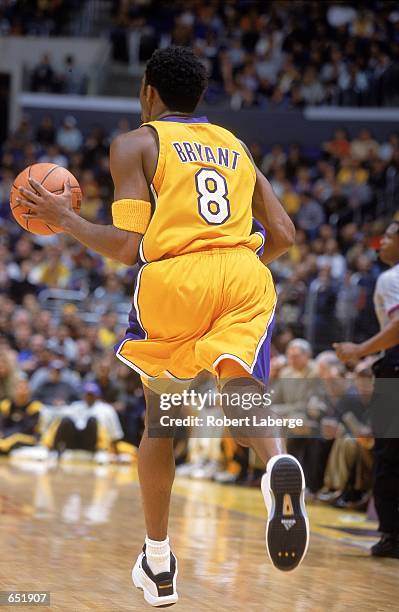 Kobe Bryant of the Los Angeles Lakers dribbles the ball down court during the game against the Dallas Mavericks at the STAPLES Center in Los Angeles,...