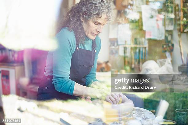 potter working at potters wheel - pottery wheel outside stock pictures, royalty-free photos & images