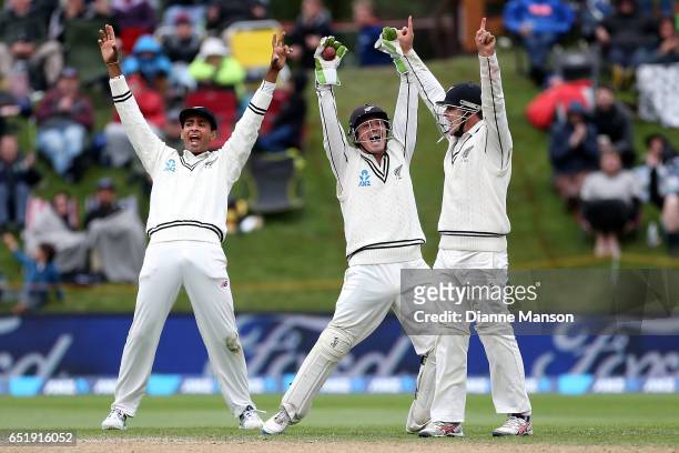 Jeet Raval , BJ Watling and Tom Latham unsucessfully appeal for the dismissal of Dean Elgar of South Africa during day four of the First Test match...