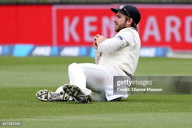 Kane Williamson of New Zealand takes the catch to dismiss Dean Elgar of South Africa during day four of the First Test match between New Zealand and...