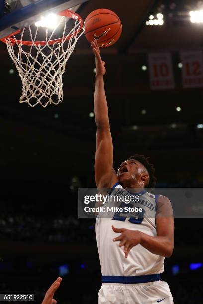 Justin Patton of the Creighton Bluejays drives to the net against Xavier Musketeers during the Big East Basketball Tournament - Semifinals at Madison...