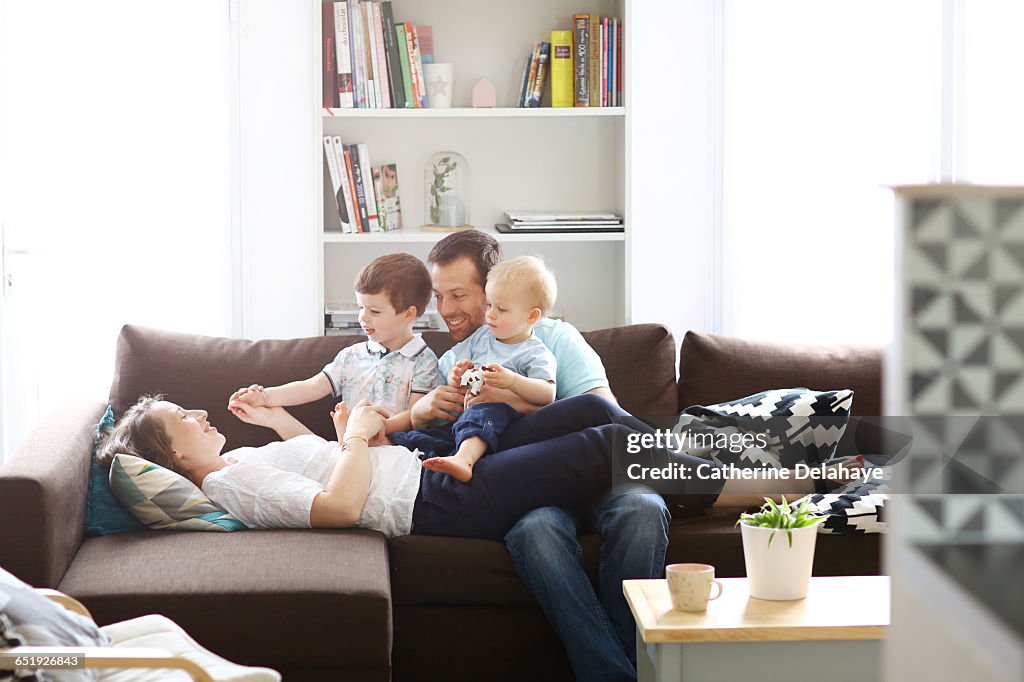 A happy family on a sofa