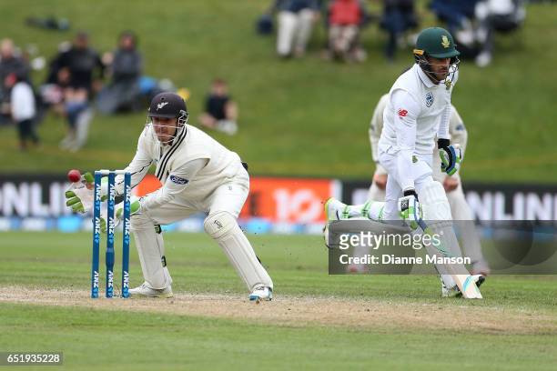 Watling of New Zealand attempts to run out Faf du Plessis of South Africa during day four of the First Test match between New Zealand and South...