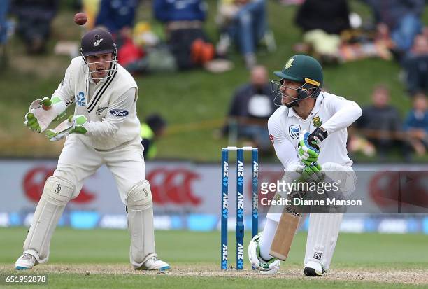 Faf du Plessis of South Africa plays a delivery as BJ Watling of New Zealand keeps wicket during day four of the First Test match between New Zealand...