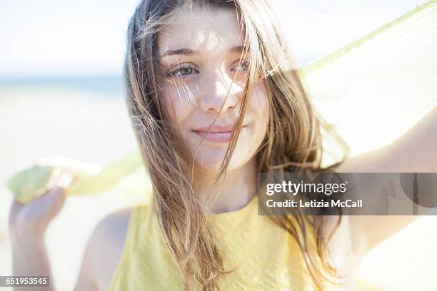 young woman playing with a yellow scarf - girl scarf bildbanksfoton och bilder